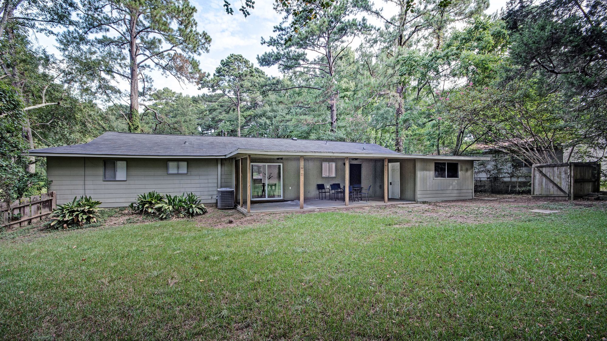 Rear exterior of the home with covered patio