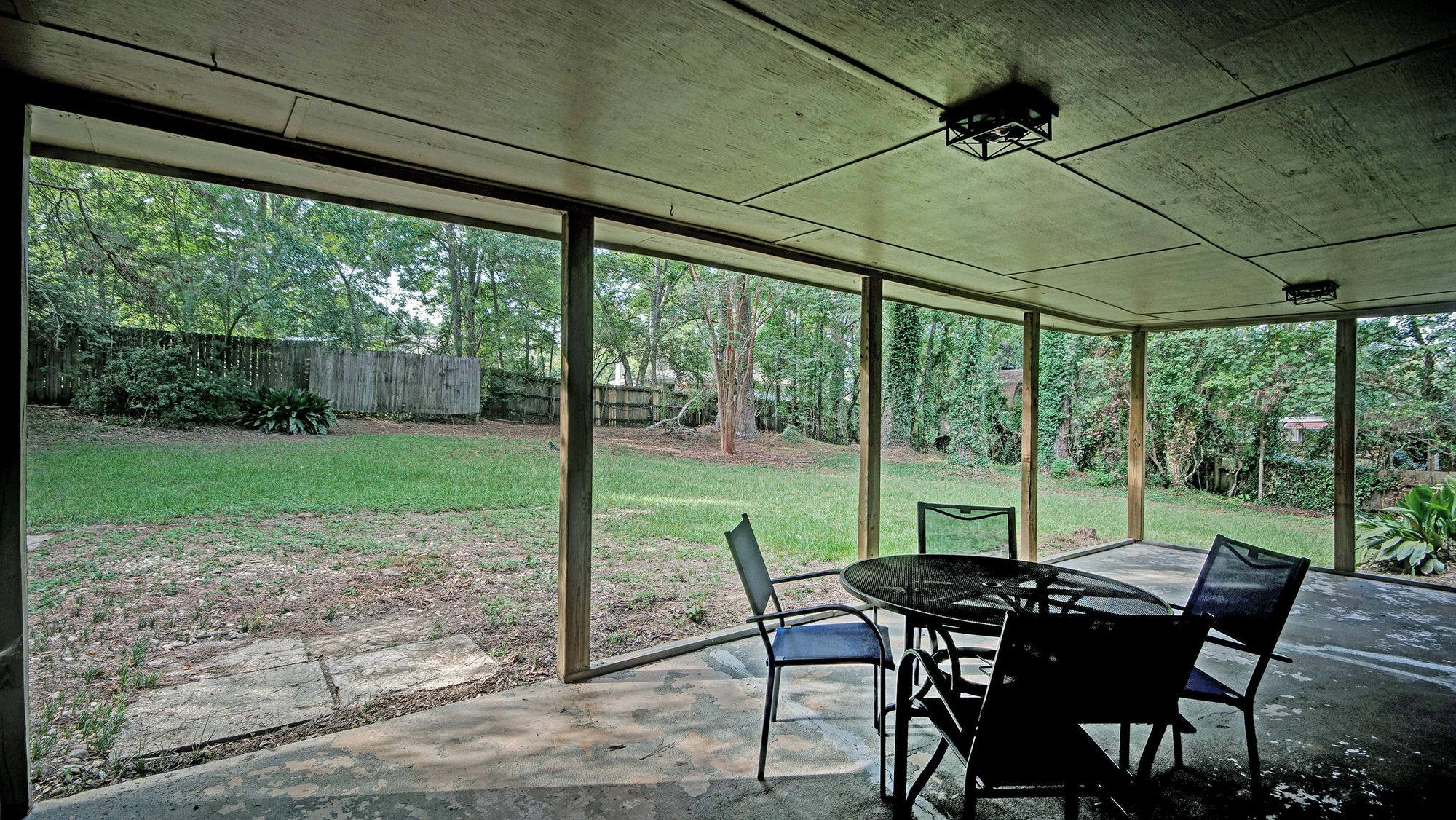 Covered back patio overlooking the backyard