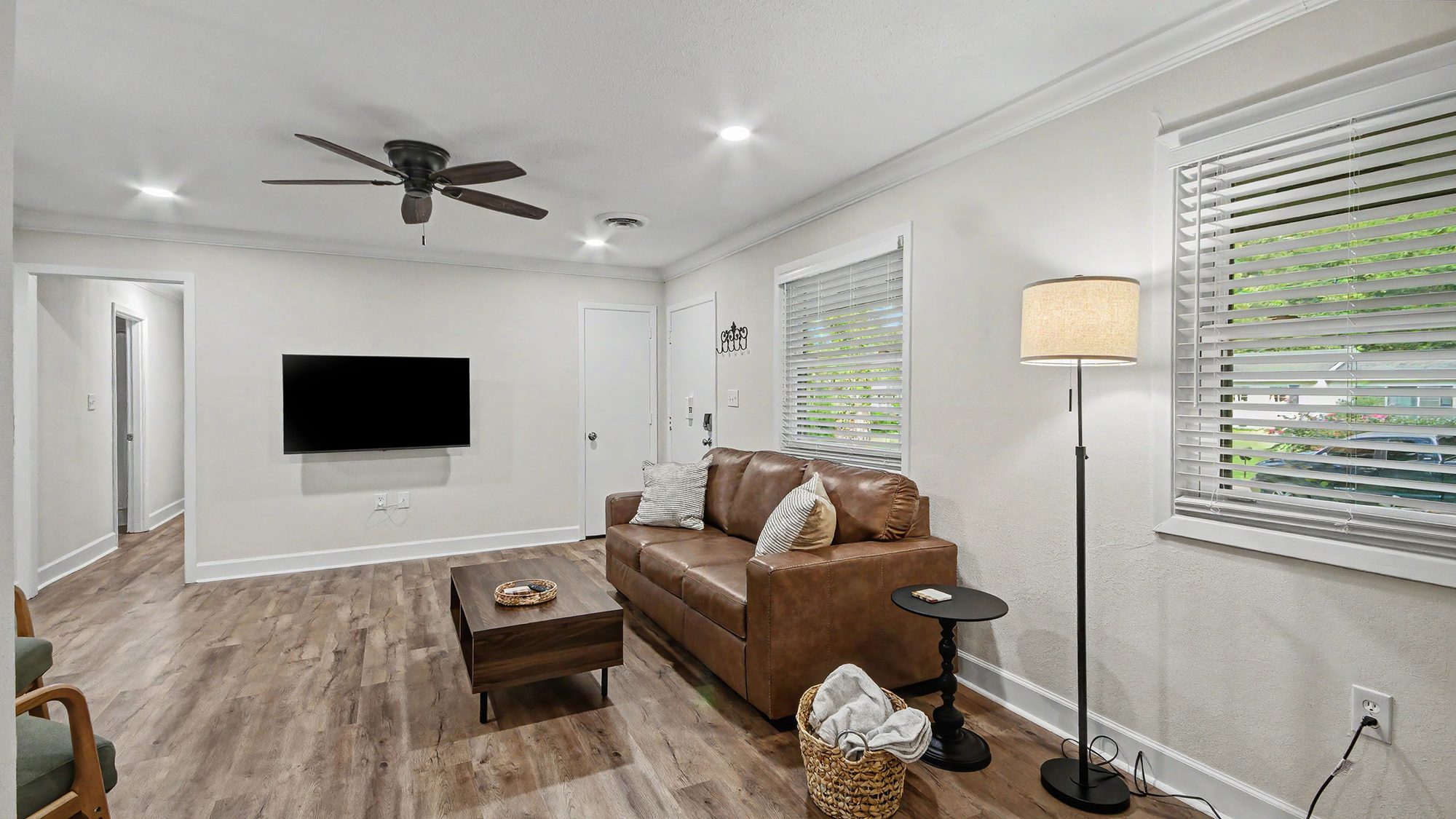 Kitchen with white cabinets, subway tile, and stainless dishwasher