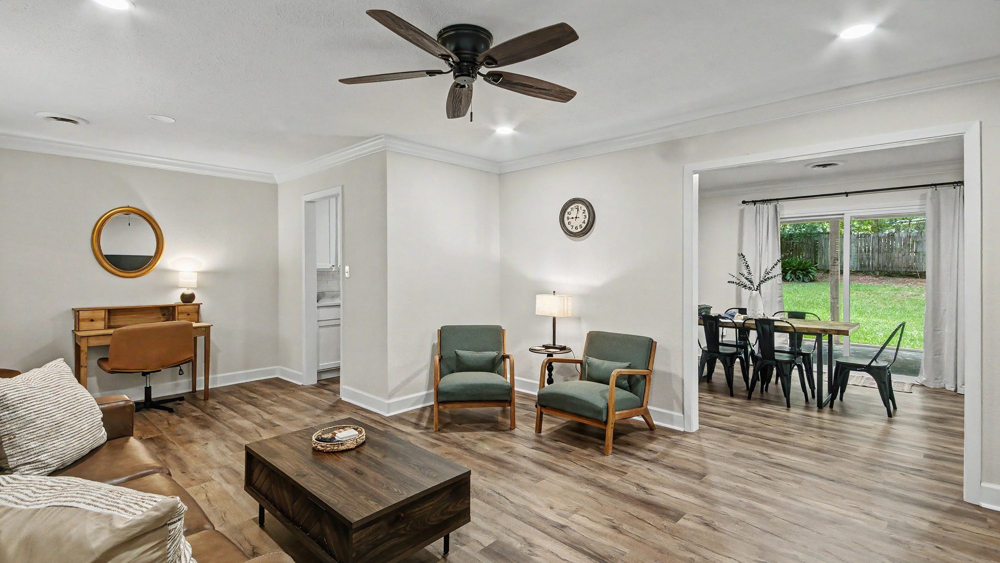 Living room with seating area and dining room beyond