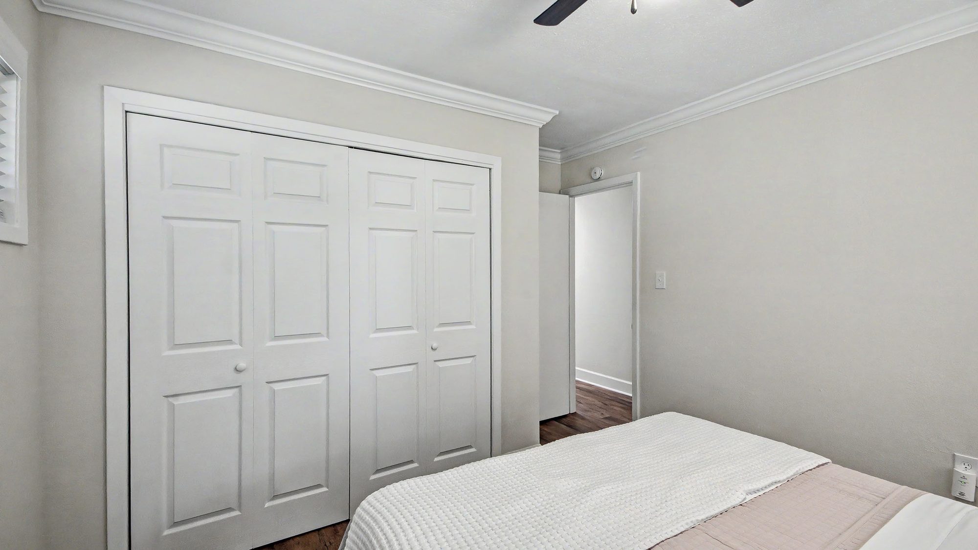 Primary bedroom closet and en-suite bathroom doorway